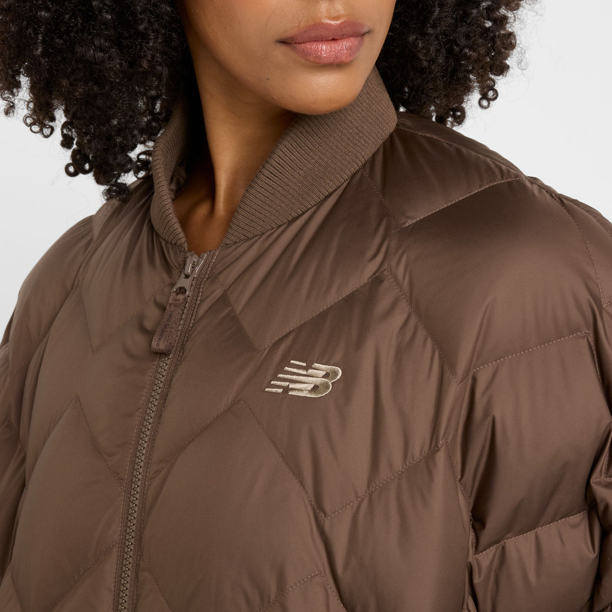 New Balance Women's Pinnacle Bomber Womens Apparel Jackets & Vests