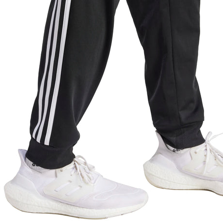 adidas Men's Essentials Warm-Up Tapered 3-Stripes Tracksuit Pants Mens Apparel Pants & Sweatpants