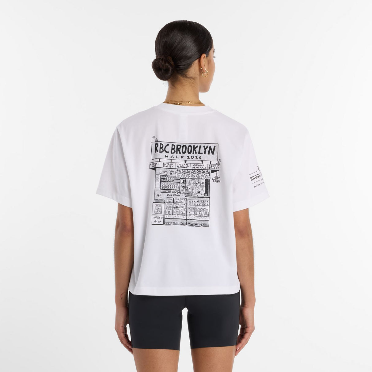 New Balance Women's RBC Brooklyn Half Graphic T-Shirt - Newspaper-3