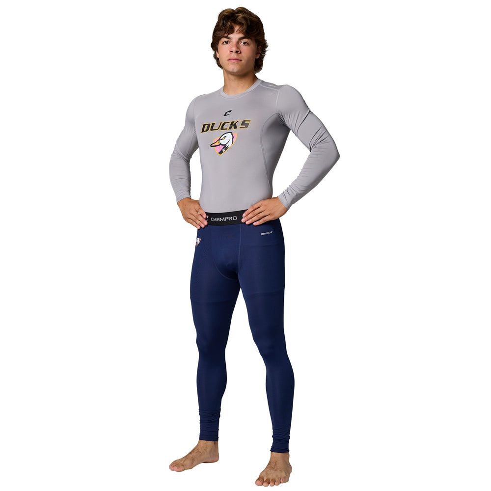 Male model wearing gray Champro Youth Lightning 2.0 compression long sleeve top and navy full length tights