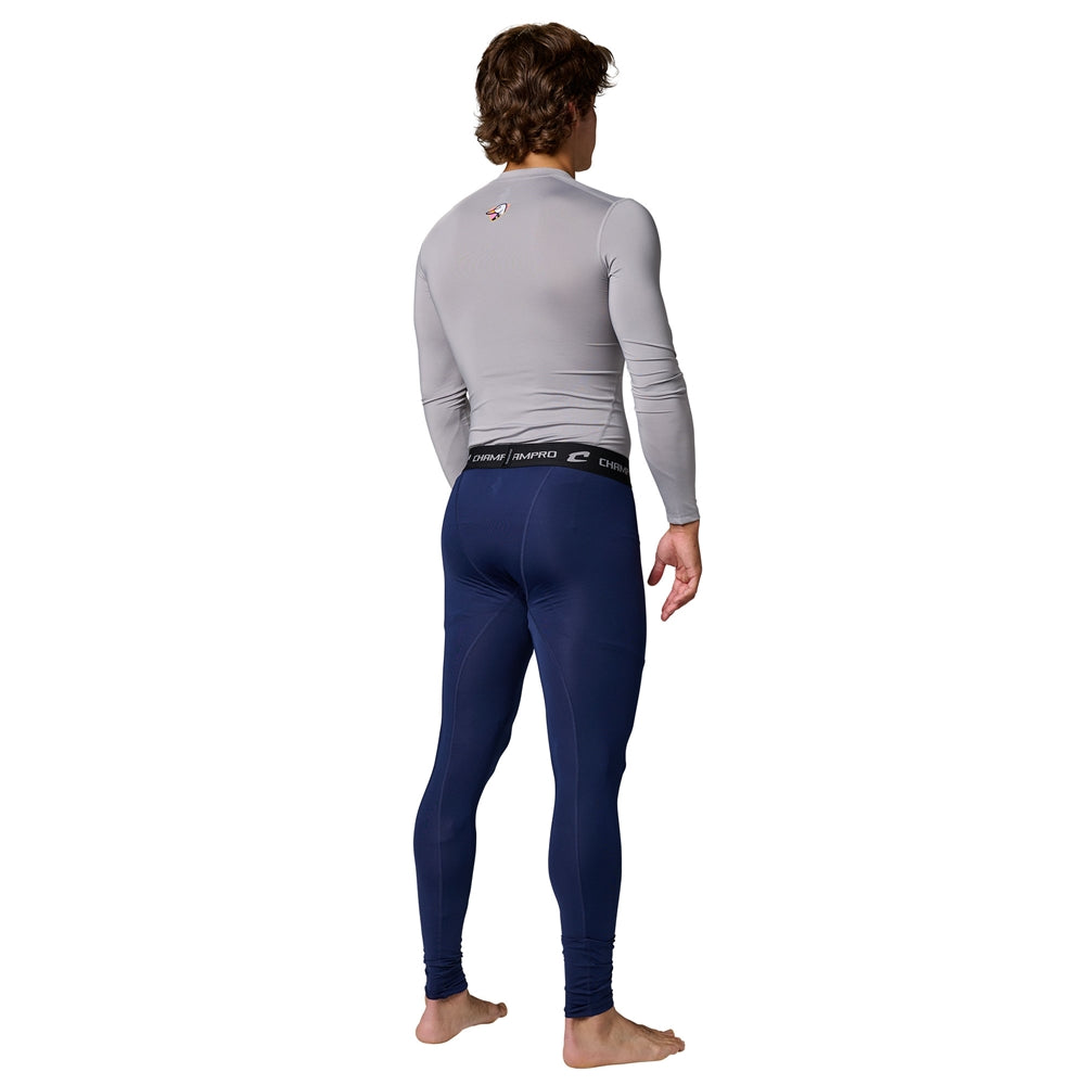 Back view of a male model wearing a light gray long sleeve compression shirt and navy Champro Youth Lightning 2.0 full length tights