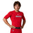 Front view of a male model wearing a red Champro Youth Lightning 2.0 compression half sleeve jersey with a Nets logo on the chest