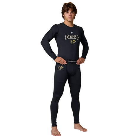 Young male model in black Champro Bears compression top and tights with a belt, facing forward with hands on hips.