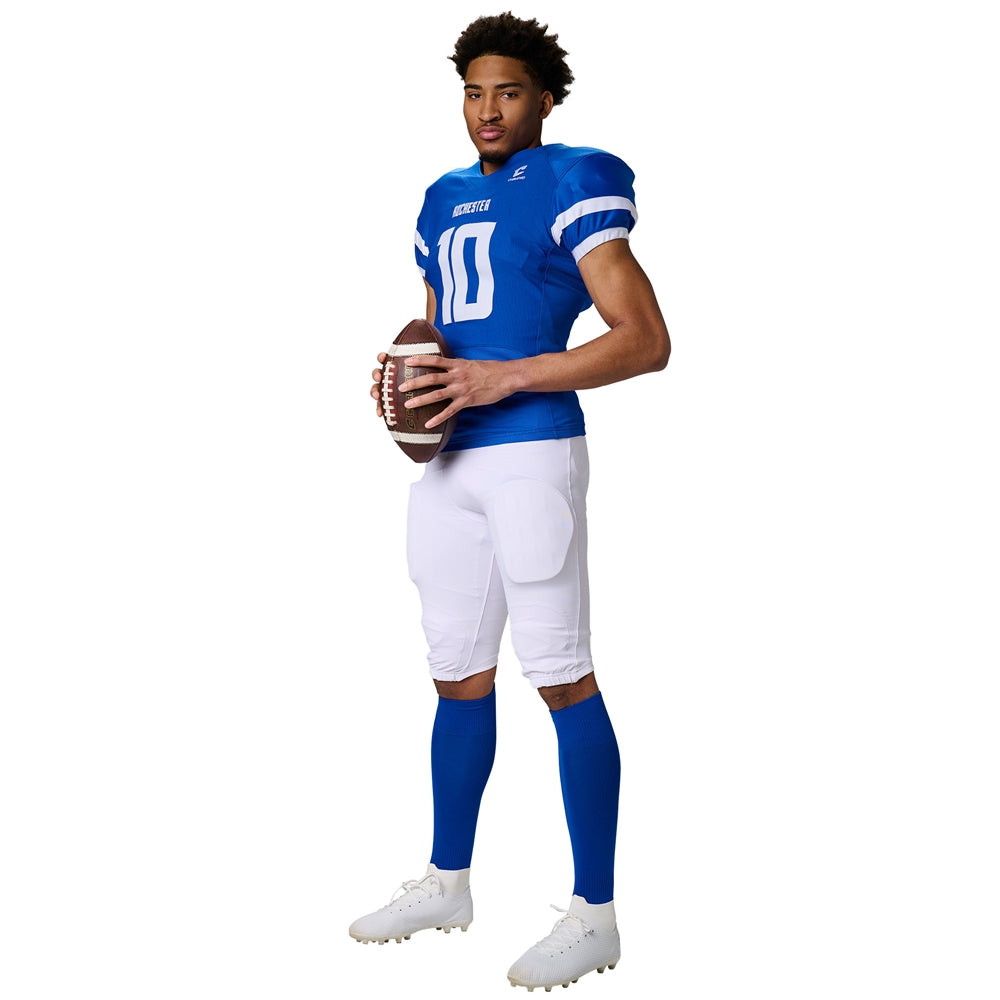 Full-body side view of a football player in a blue Champro Game Day jersey and white padded football pants with blue socks.