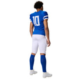 Back view of a football player wearing a blue jersey with the number 10 and white pants, blue socks and white cleats.